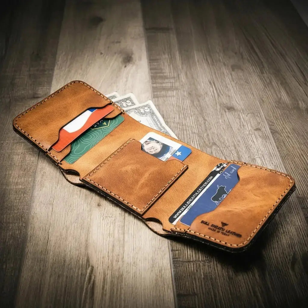Brown leather trifold wallet with credit cards and cash inside.