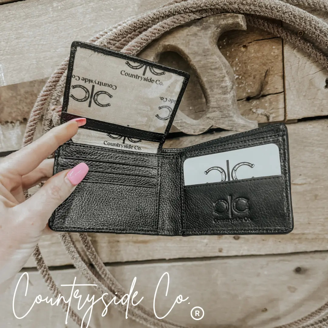 Black leather bifold wallet with Countryside Co. logo and card slots