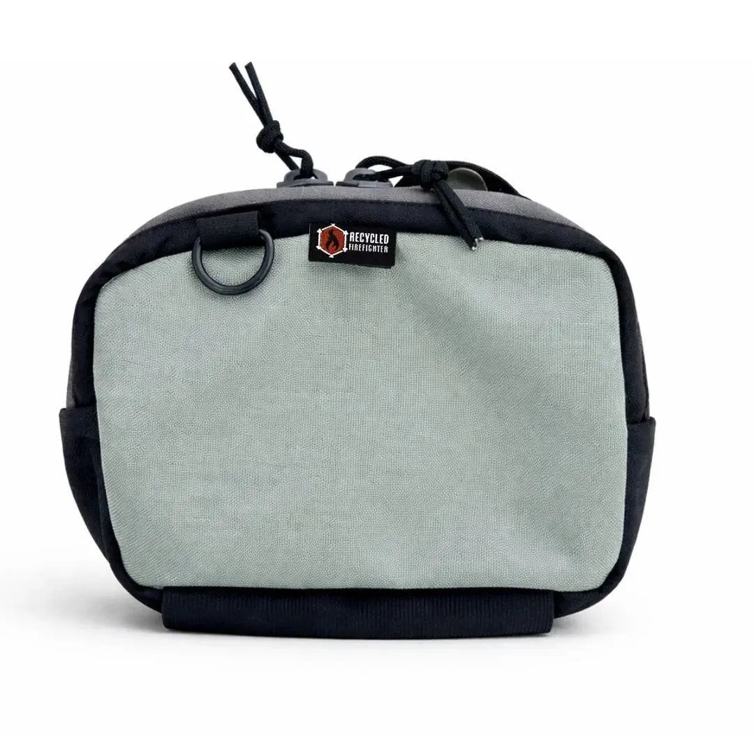 Black and gray Cordura fanny pack with D-ring and drawstring detail.