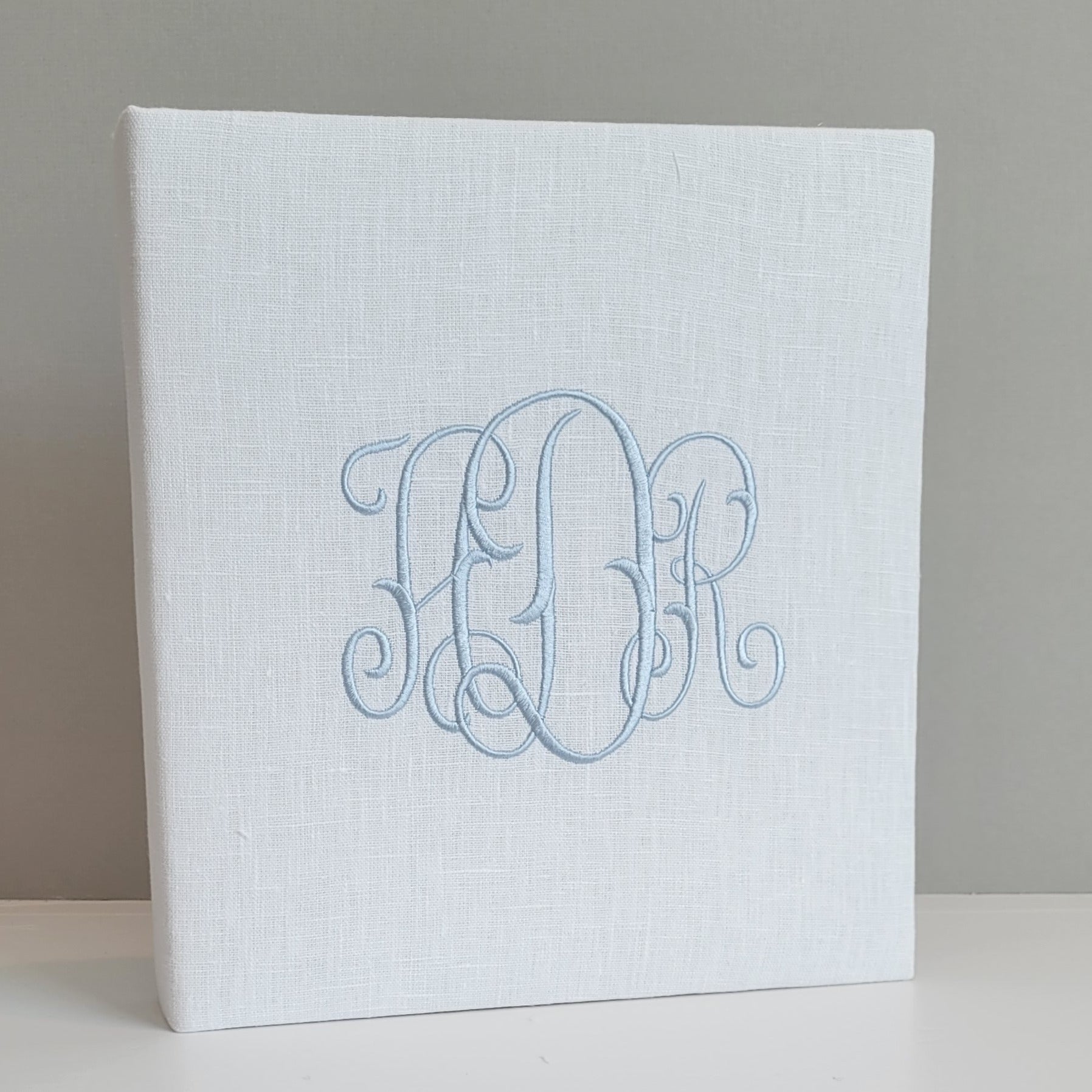 White linen handmade baby memory book with ice blue monogram by AP Creations