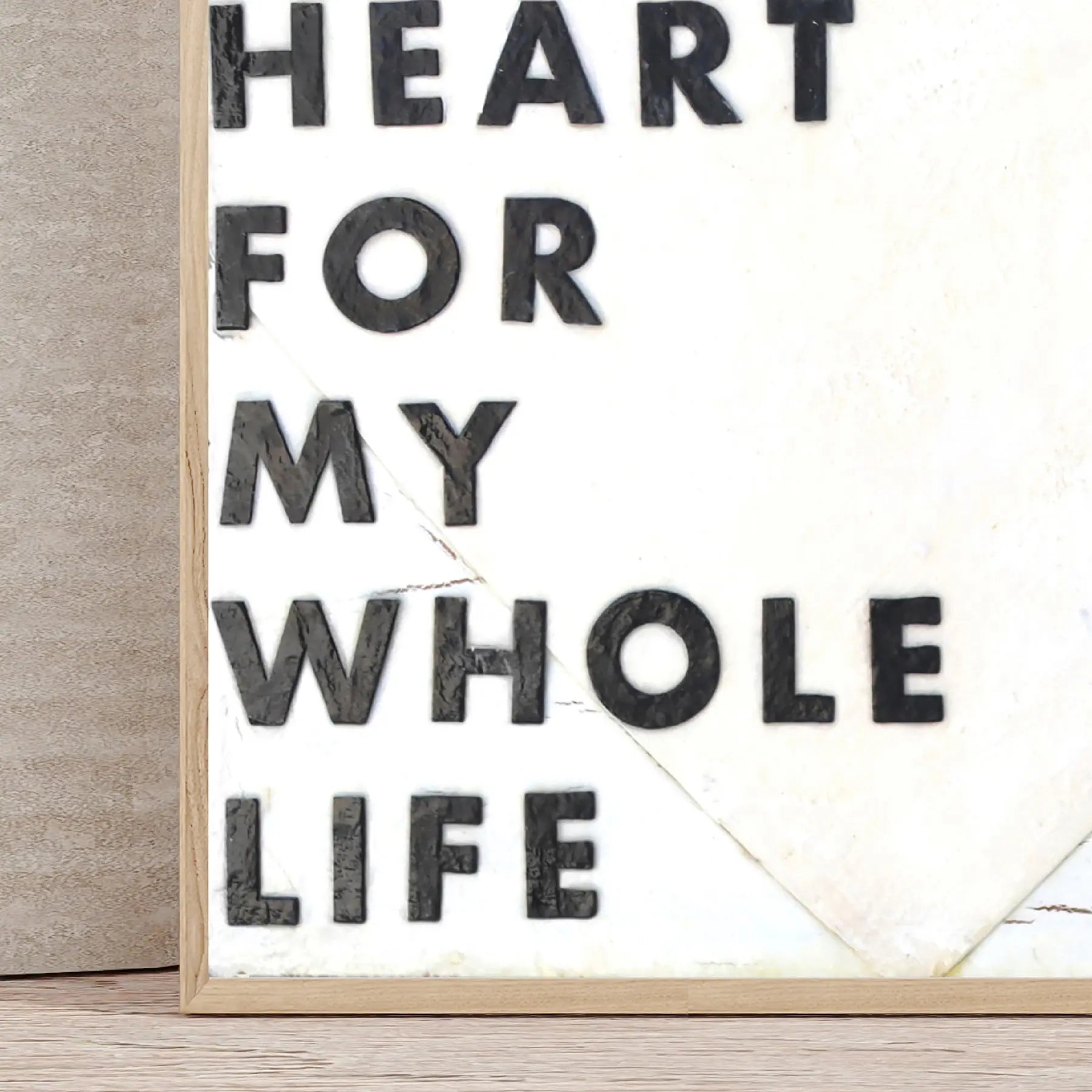 Heart Whole Life text on white background with wooden frame.