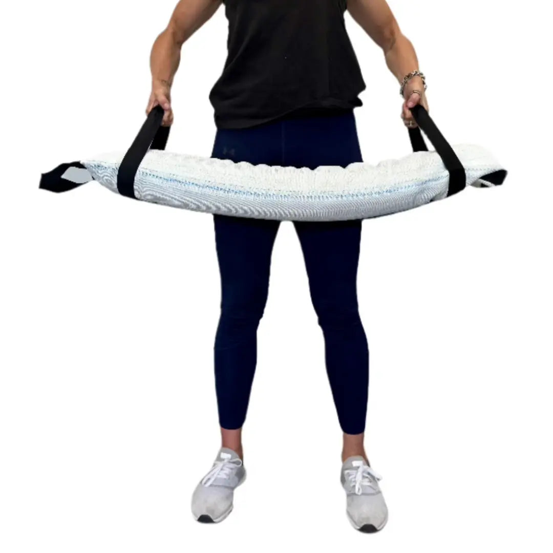 Person holding a recycled fire hose battle bag for workouts.