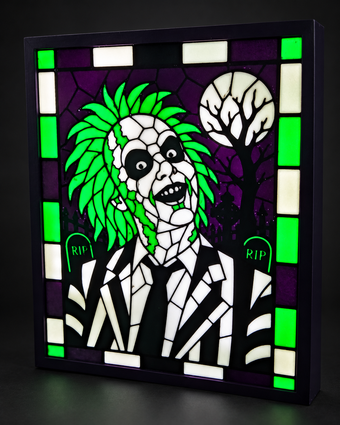 Angled view showing the depth and glow of an 8 by 10 Beetlejuice lightbox