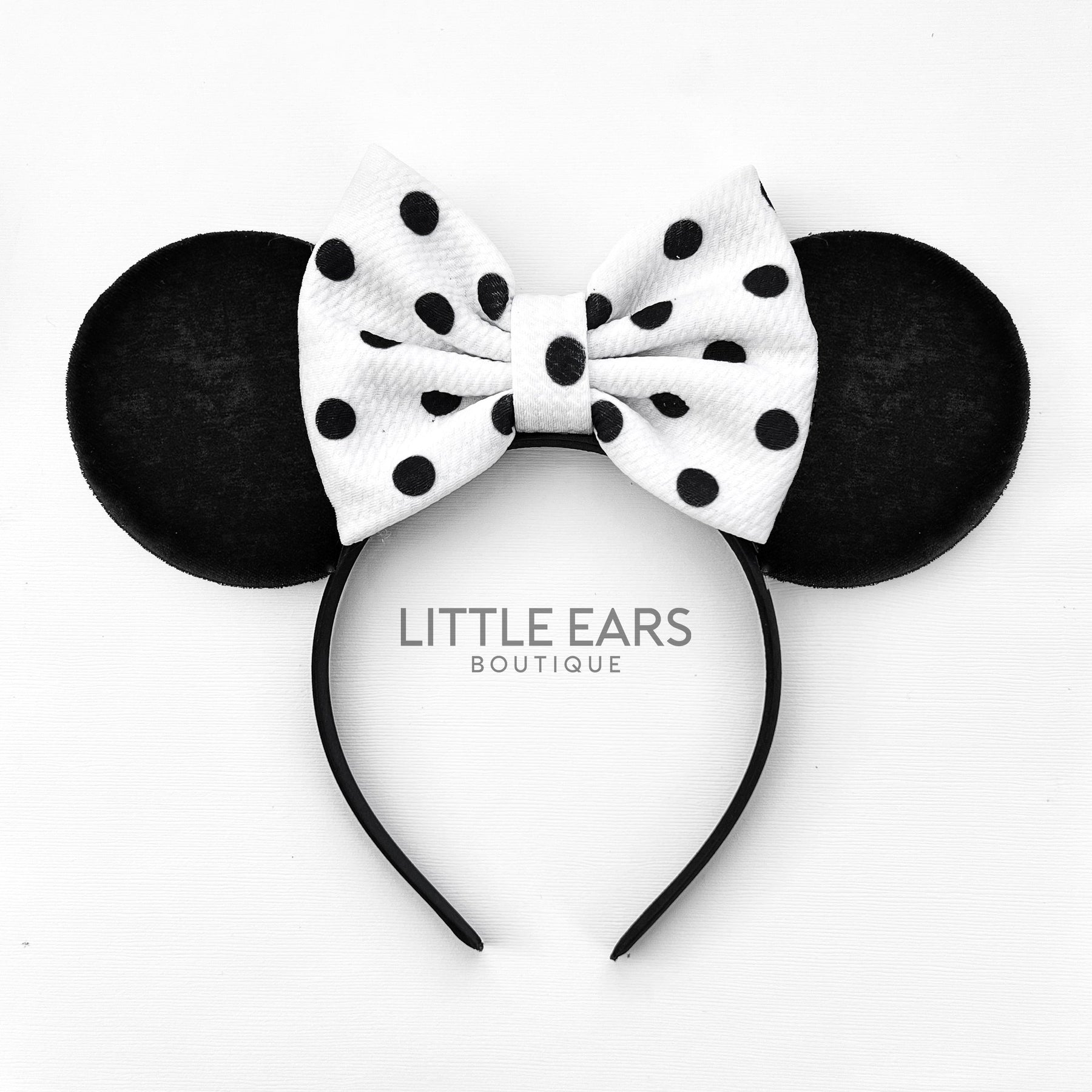Black Dotted Bow Ears by Little Ears Boutique, travel planning service main product photo