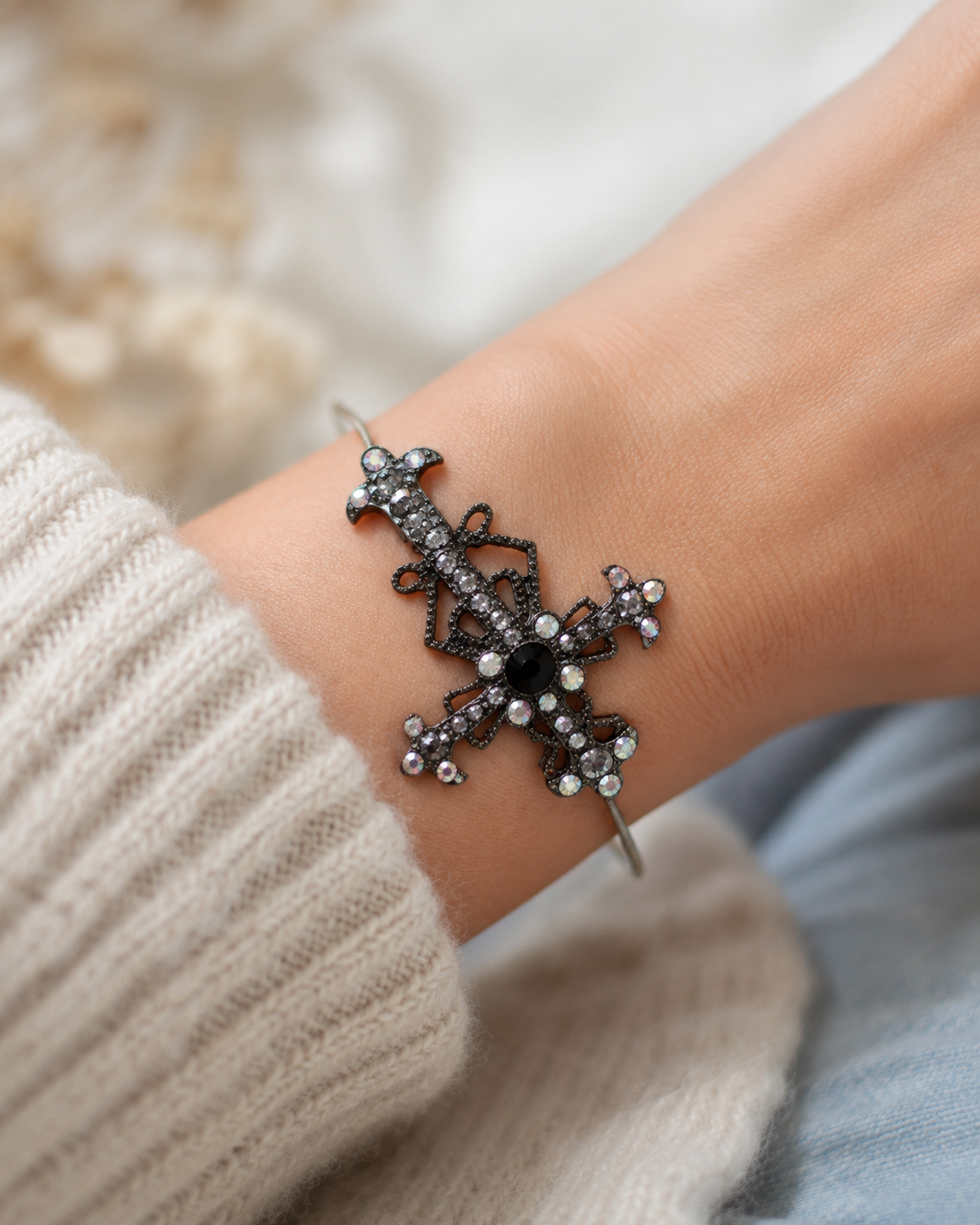Decorative bracelet on a wrist with a neutral background