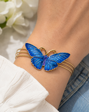 blue butterfly bracelet on wrist