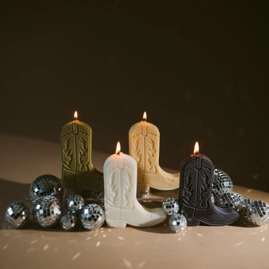 Cowboy boot shape candles by gold + ivy, scented candle main product photo