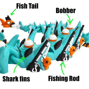 Close-up of fishing dragon details including fish tail, bobbers, shark fins, fishing rods, and hooks
