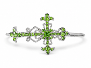 Silver bracelet with green gemstones on a white background