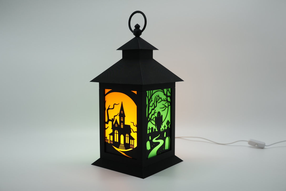 Halloween LED lantern with haunted house and graveyard scene panels