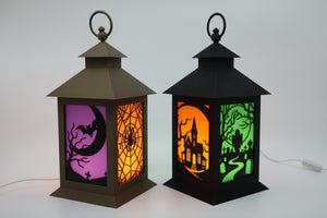 Set of two black Halloween LED lanterns with illuminated spooky scene panels