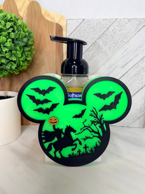 Halloween soap dispenser holder displayed beside a sink