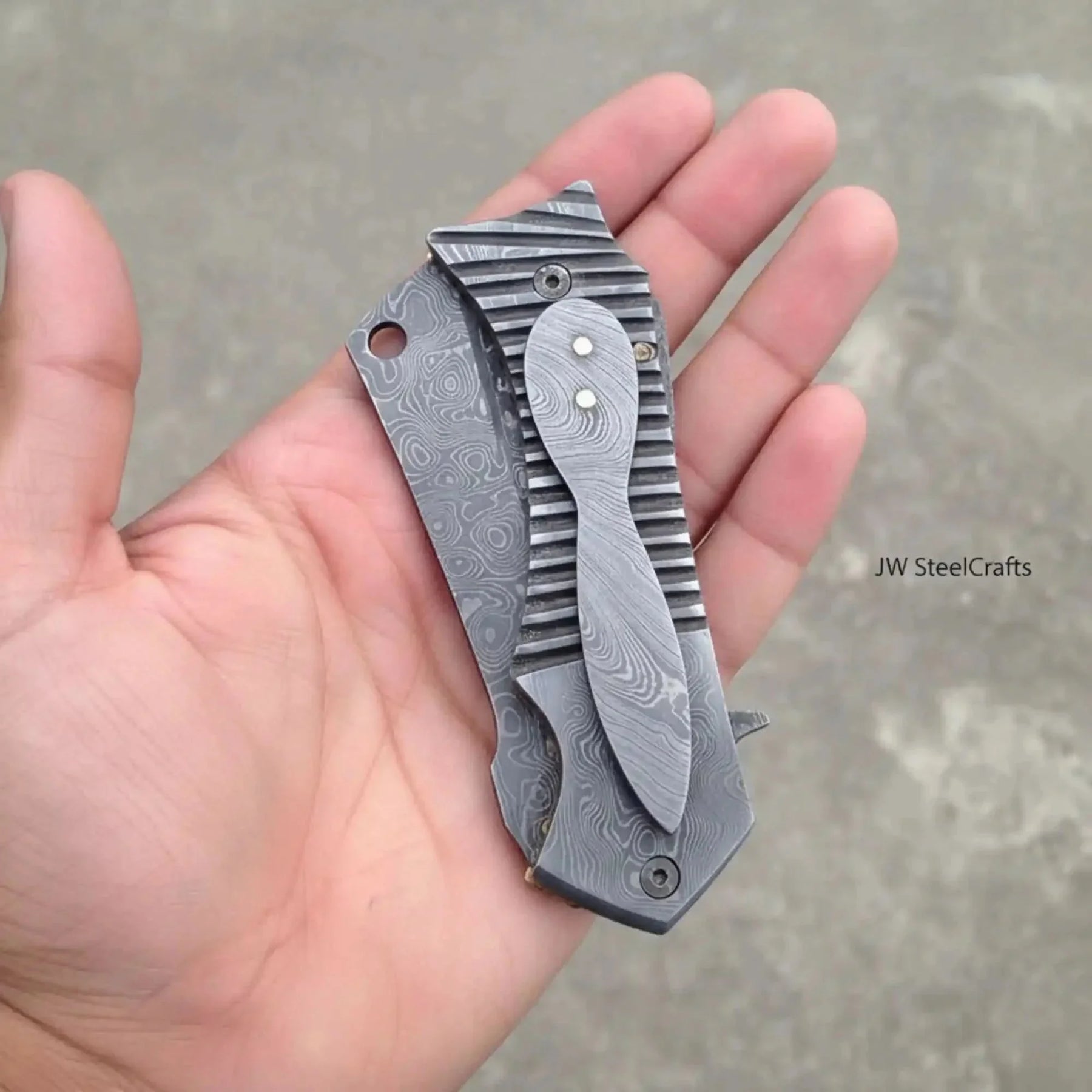 Damascus Flipper Pocket Cleaver with Fluted Metal Handle detail view by JW SteelCrafts