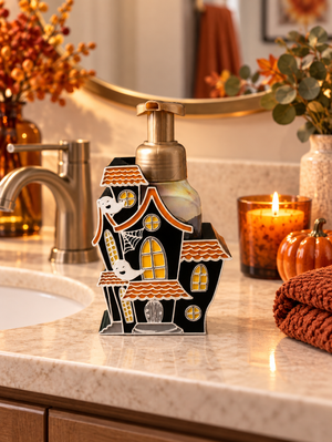Haunted house Halloween soap dispenser holder styled on a bathroom vanity