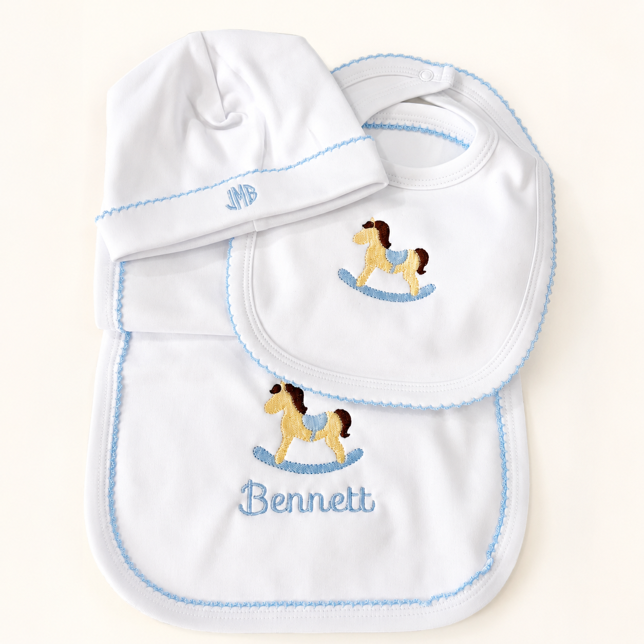 Embroidered white and blue baby gift set