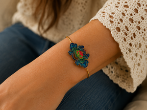 Close-up of a wrist wearing a colorful bracelet with a blurred background