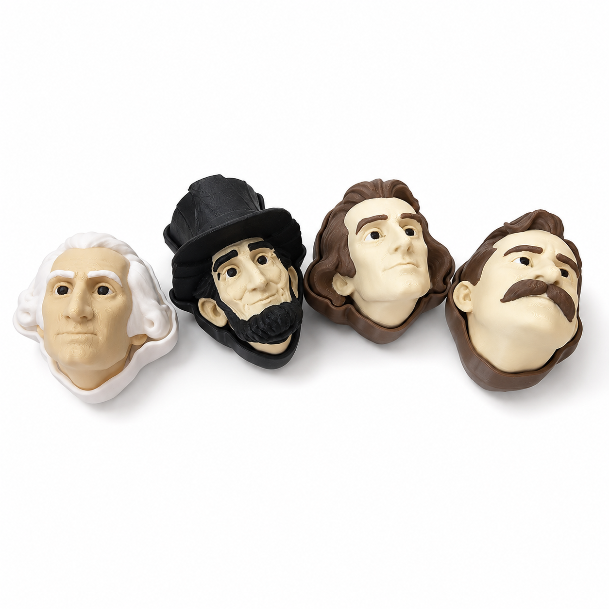 Four 3D printed president clicker heads arranged on a plain white background