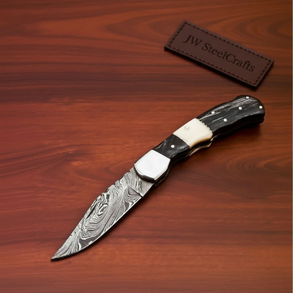 Handmade Damascus Folding Pocket Knife – Engraved & Plain Handle Variants | Leather Sheath Included by JW SteelCrafts, leather knife sheath detail photo 2