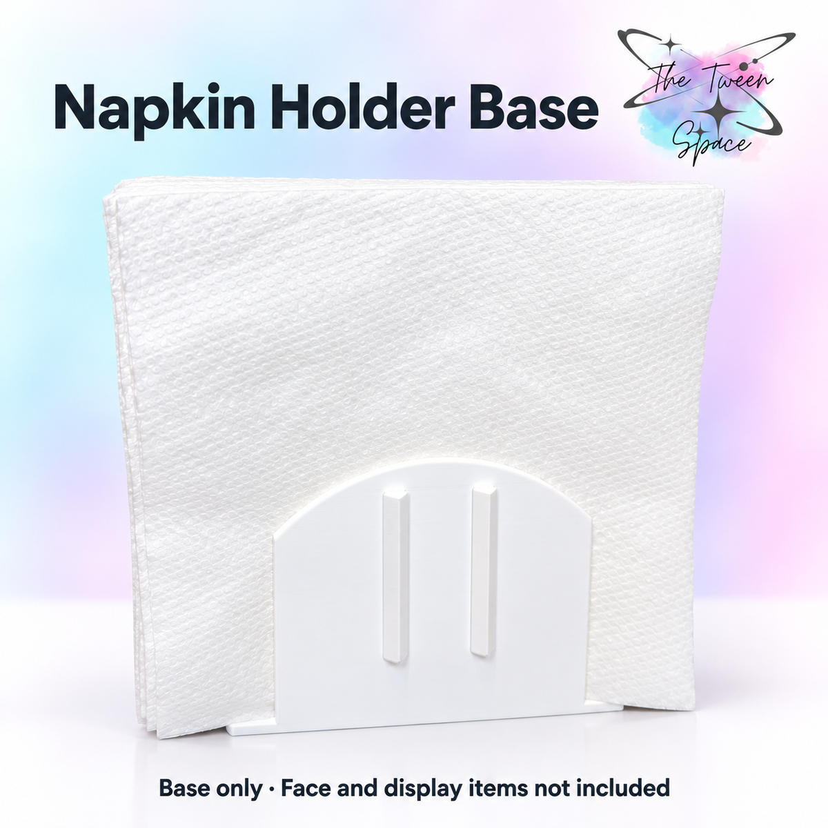 Interchangeable Napkin Holder Base with The Tween Space branding; decorative faces and display accessories not included
