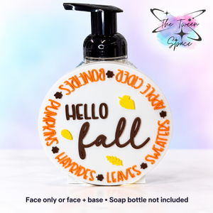 Hello Fall Round interchangeable face by The Tween Space, shown on a standard base with soap bottle for display; choose face only or face plus base.