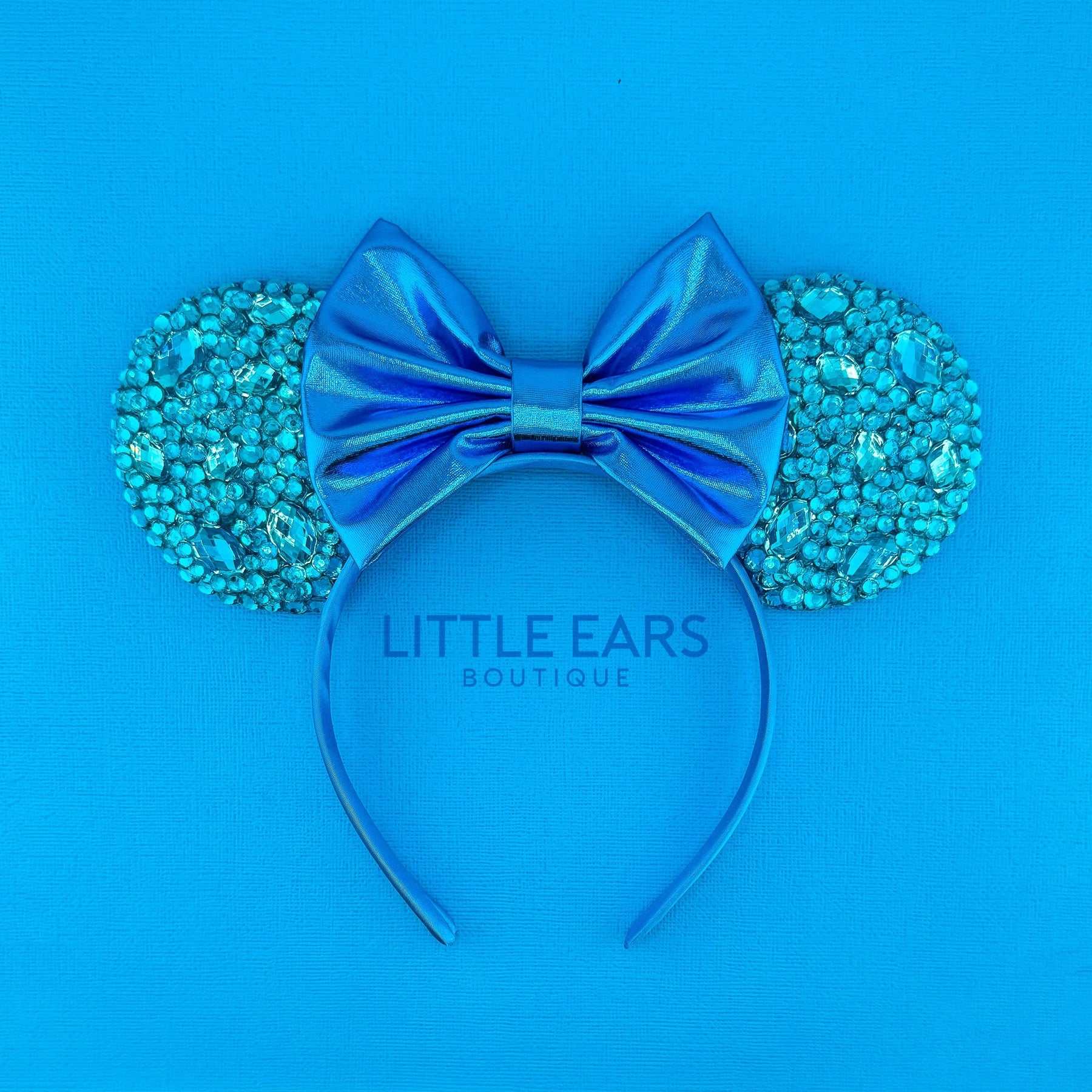 Turquoise Sparkle Ears by Little Ears Boutique, travel planning service main product photo