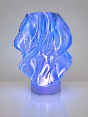 Blue transparent PLA 3D printed lamp with LED light by The Tween Space on a clean background