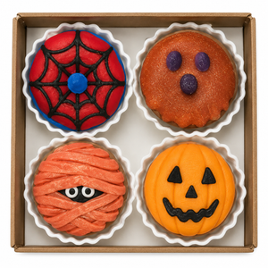 Gift box of four assorted Halloween donut clicker fidgets with spiderweb, ghost, mummy and pumpkin designs