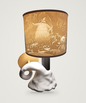 Alternate view of The Tween Space lithophane lamp showing illuminated Oogie Boogie artwork and the sculpted white spiral base on a neutral backdrop.