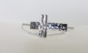 Silver colored hammered cross bracelet