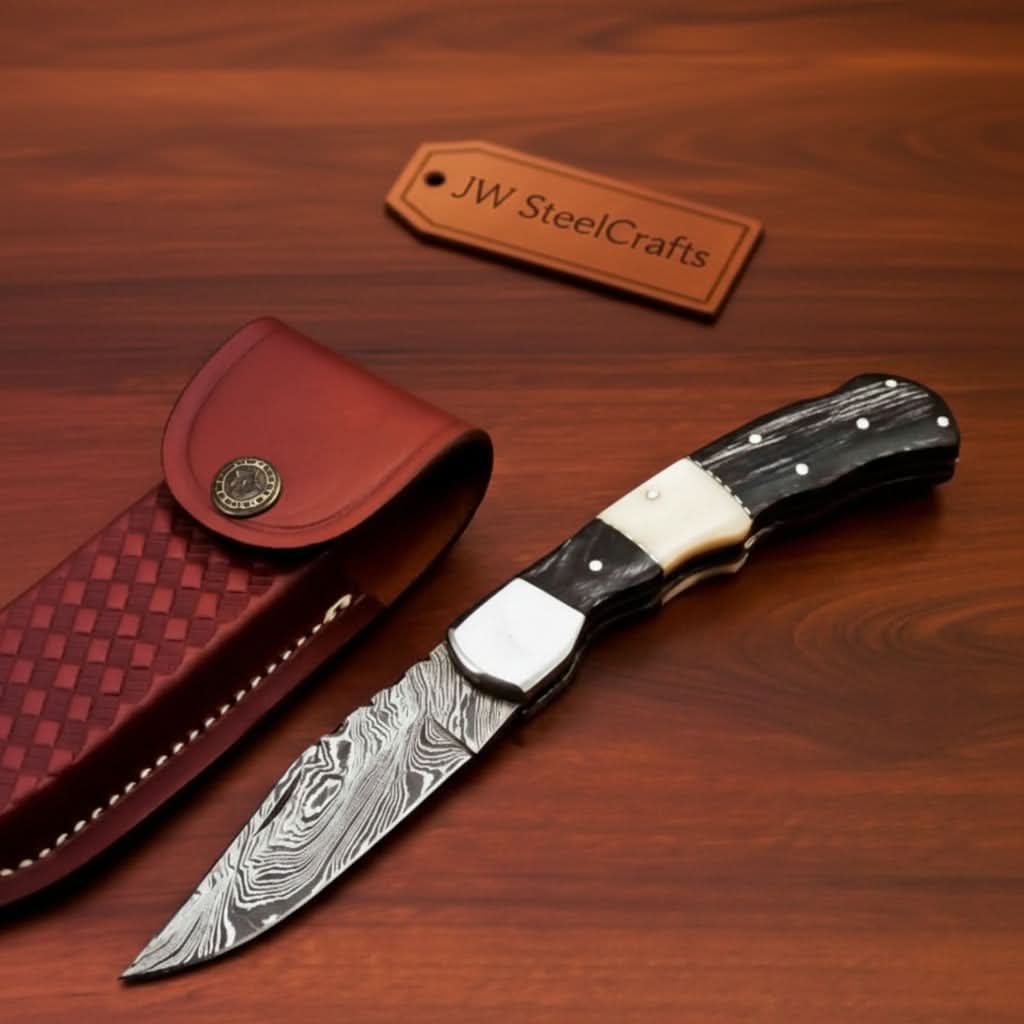 Handmade Damascus Folding Pocket Knife – Engraved & Plain Handle Variants | Leather Sheath Included by JW SteelCrafts, leather knife sheath main product photo