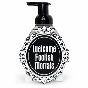 Welcome Foolish Mortals black and white Halloween soap dispenser on white background
