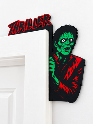 Dancing zombie Halloween door corner hanger installed on a white door frame close up