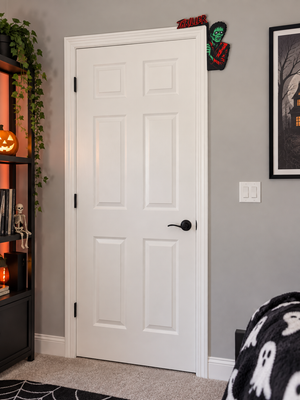 Small dancing zombie Halloween door corner hanger displayed on a full bedroom door